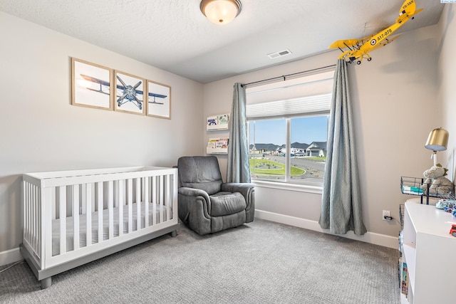 6416 Recurve Rd, Pasco, WA 99301 - bedroom featuring carpet flooring, baseboards, and a crib