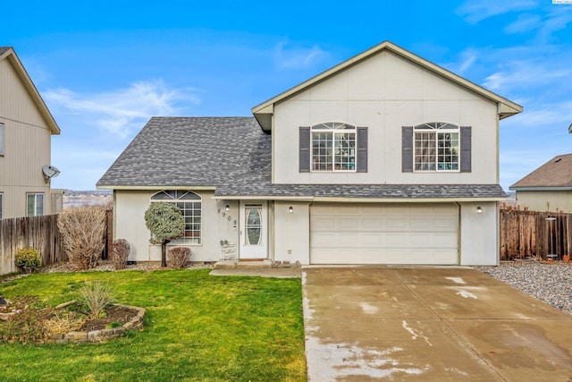 front of property with a garage and a front lawn