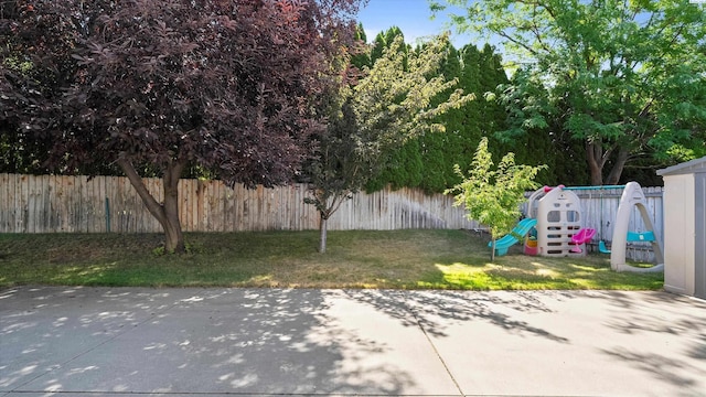5405 Warbler Ln, West Richland, WA 99353 - fenced backyard featuring a playground and a patio