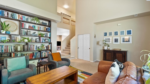 5405 Warbler Ln, West Richland, WA 99353 - living area featuring carpet flooring, stairway, and a towering ceiling