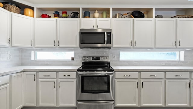 5405 Warbler Ln, West Richland, WA 99353 - kitchen with stainless steel appliances, white cabinetry, and light countertops