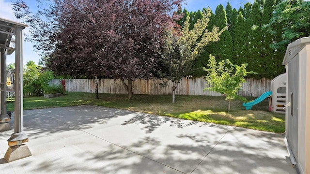 5405 Warbler Ln, West Richland, WA 99353 - fenced backyard with a patio area and a playground