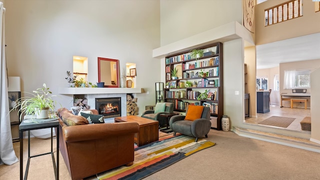5405 Warbler Ln, West Richland, WA 99353 - living area featuring a towering ceiling, carpet, and a fireplace