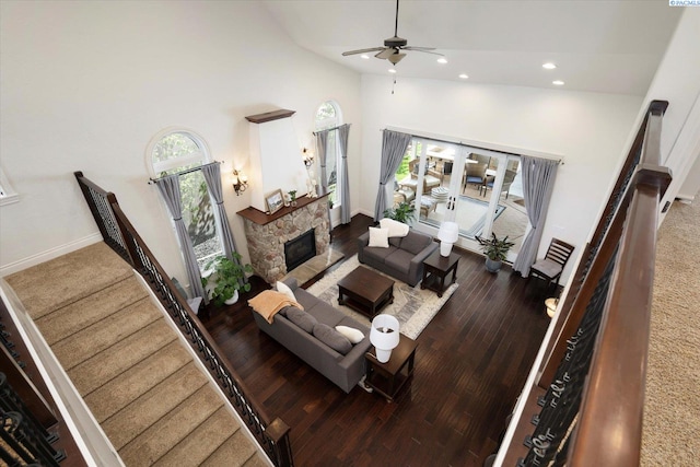 1010 Christopher Ln, Pasco, WA 99301 - living room with high vaulted ceiling, a ceiling fan, stairs, recessed lighting, and a stone fireplace