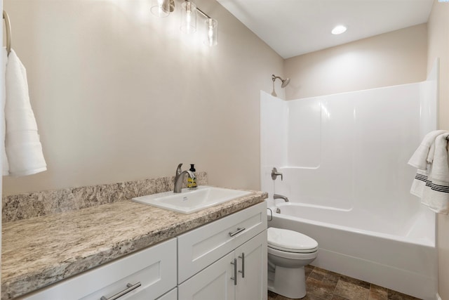 full bathroom featuring vanity, toilet, and  shower combination