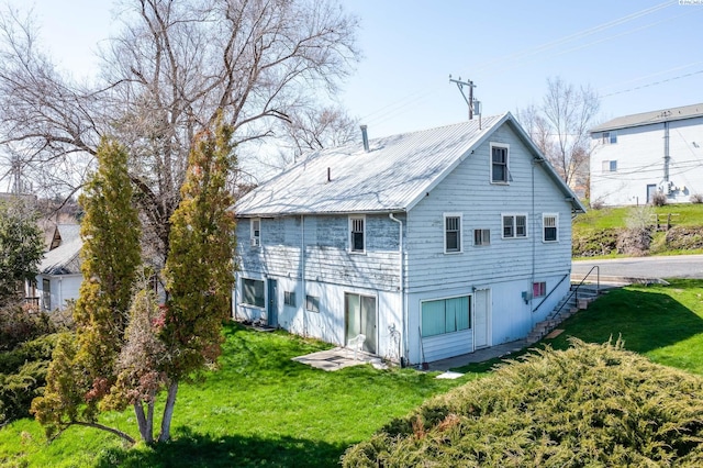 550 NW State St, Pullman, WA 99163 - back of house featuring metal roof and a lawn