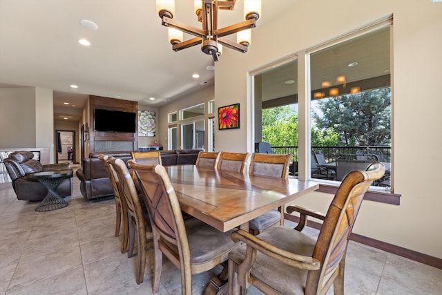 dining room with recessed lighting, light tile patterned floors, a chandelier, and baseboards
