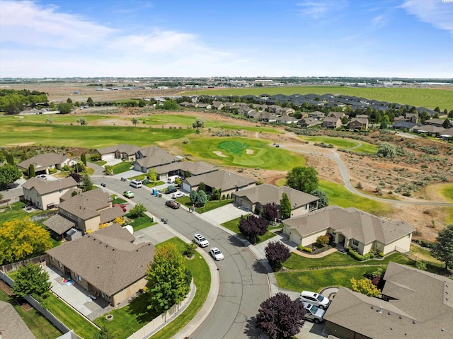 aerial perspective of suburban area featuring a local golf course