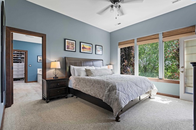 bedroom with light colored carpet, baseboards, and ceiling fan
