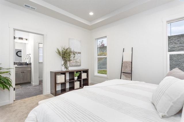 2408 Maggio Loop, Richland, WA 99352 - carpeted bedroom featuring visible vents, recessed lighting, a sink, and multiple windows