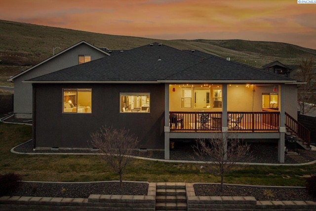 5298 S Quincy Pl, Kennewick, WA 99337 - rear view of house with a wooden deck, stucco siding, and roof with shingles