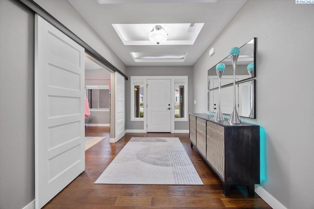 5298 S Quincy Pl, Kennewick, WA 99337 - foyer entrance with dark wood-type flooring, a tray ceiling, and baseboards