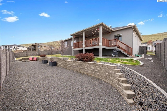 5298 S Quincy Pl, Kennewick, WA 99337 - rear view of house featuring a fenced backyard, a gate, a deck, and stairway