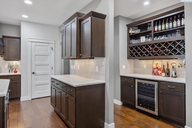 5298 S Quincy Pl, Kennewick, WA 99337 - bar featuring recessed lighting, a bar, dark wood-style flooring, wine cooler, and decorative backsplash