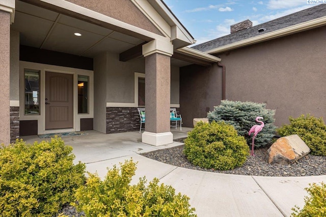 5298 S Quincy Pl, Kennewick, WA 99337 - doorway to property featuring stone siding, a patio, and stucco siding
