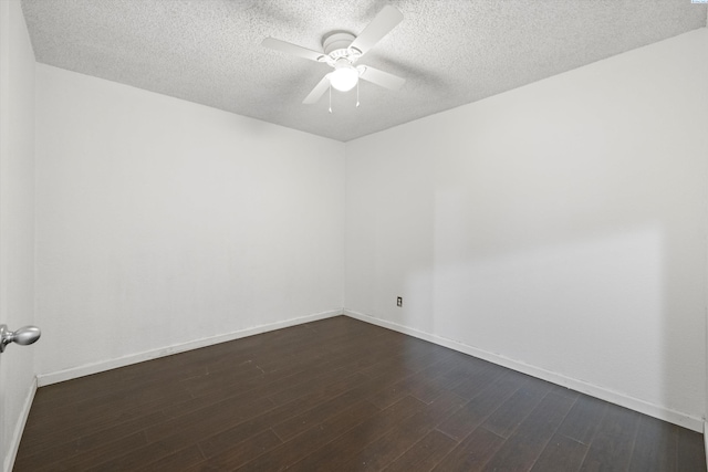 empty room with ceiling fan, a textured ceiling, and dark hardwood / wood-style flooring