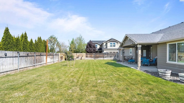 view of yard featuring a fenced backyard and a patio area