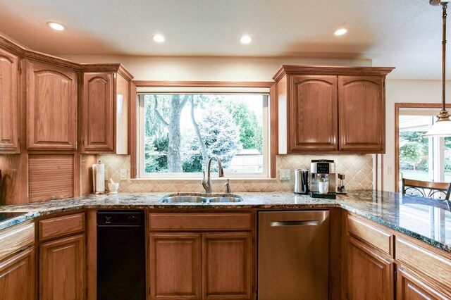 3114 Rd 103, Pasco, WA 99301 - kitchen with light stone countertops, dishwasher, a sink, and decorative backsplash