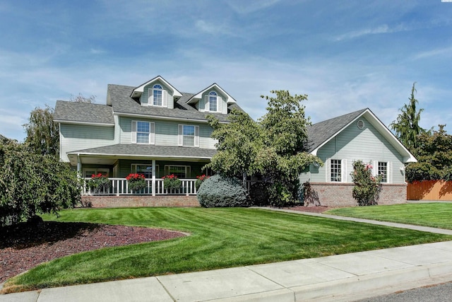 view of front of home featuring a front lawn and a porch