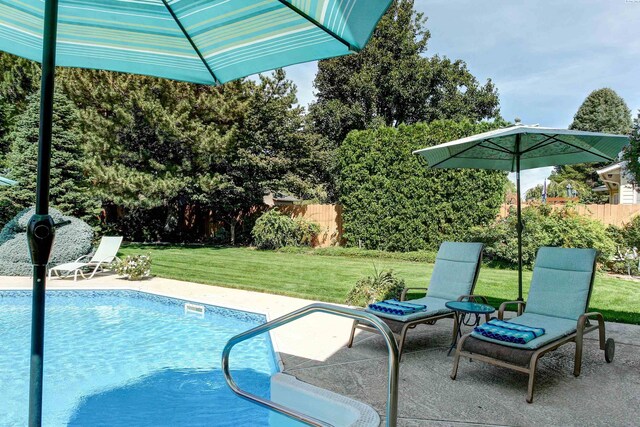 3114 Rd 103, Pasco, WA 99301 - view of swimming pool with a patio, a fenced in pool, fence, and a lawn