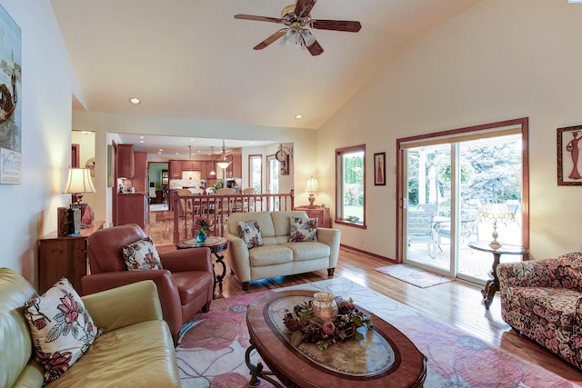 3114 Rd 103, Pasco, WA 99301 - living area featuring high vaulted ceiling, light wood finished floors, recessed lighting, and ceiling fan with notable chandelier