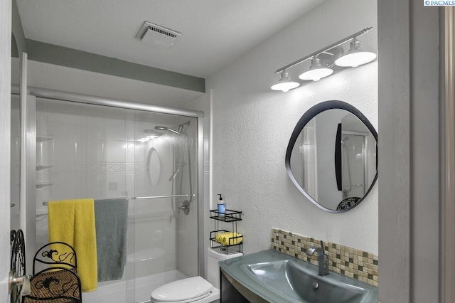 141 Travis Ln, Kennewick, WA 99338 - full bathroom featuring a stall shower, decorative backsplash, and vanity