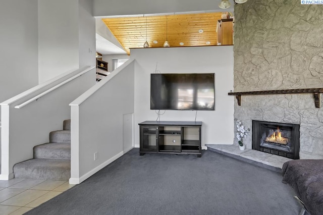 141 Travis Ln, Kennewick, WA 99338 - carpeted living room featuring stairway and a stone fireplace