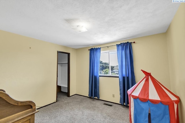 141 Travis Ln, Kennewick, WA 99338 - carpeted bedroom featuring a textured ceiling