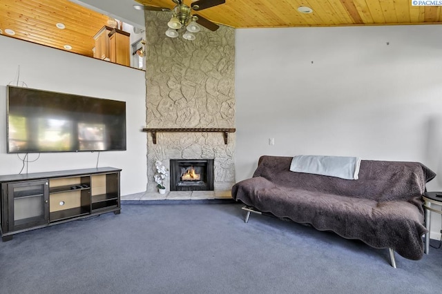 141 Travis Ln, Kennewick, WA 99338 - living area with wooden ceiling, carpet flooring, ceiling fan, a high ceiling, and a stone fireplace