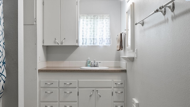 1707 W 19th Ave, Kennewick, WA 99337 - bathroom featuring vanity and a textured wall