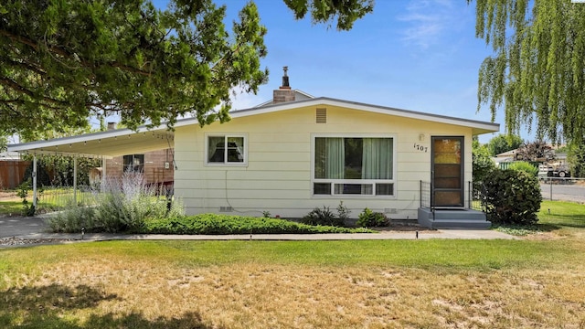 1707 W 19th Ave, Kennewick, WA 99337 - view of front of home with an attached carport and a chimney