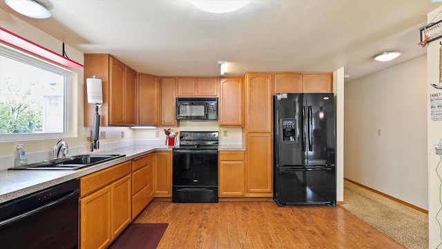 1707 W 19th Ave, Kennewick, WA 99337 - kitchen featuring black appliances, light countertops, and light wood-style floors