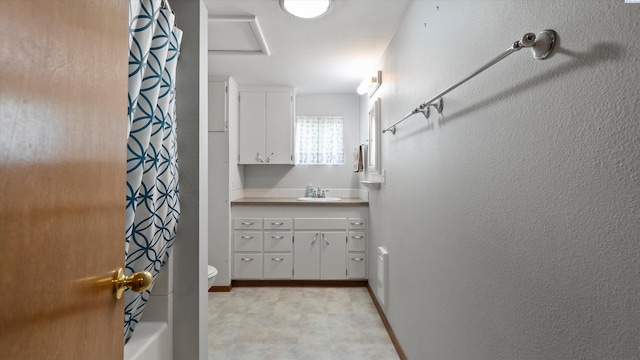 1707 W 19th Ave, Kennewick, WA 99337 - full bathroom featuring vanity, tile patterned floors, and shower / tub combo