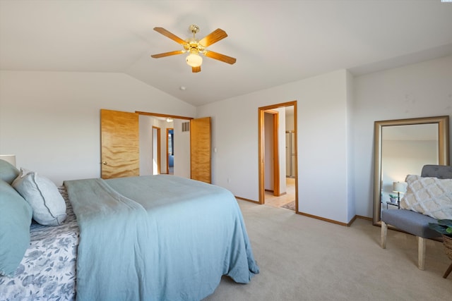 bedroom featuring a ceiling fan, lofted ceiling, light colored carpet, and baseboards