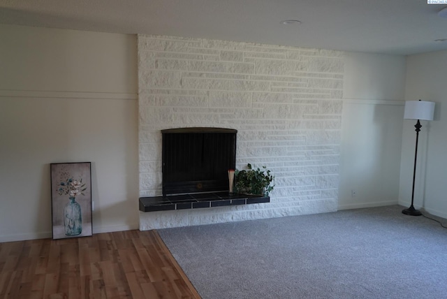 unfurnished living room with hardwood / wood-style flooring