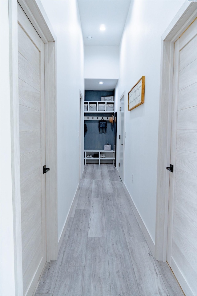 hall with light hardwood / wood-style flooring