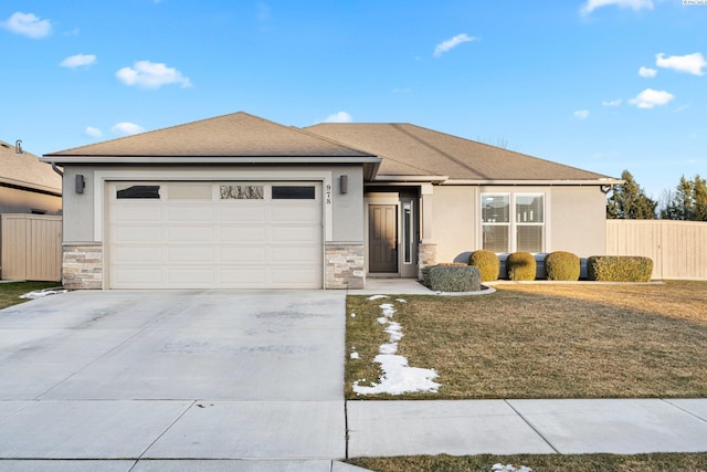 view of front of home featuring a garage and a front yard