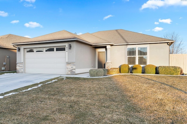 view of front of house with a garage and a front yard