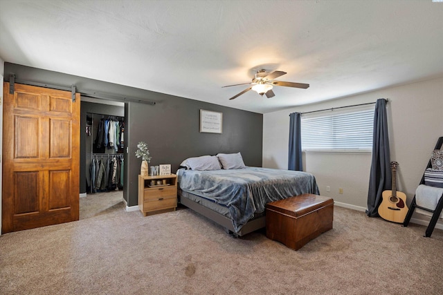 3321 W 24th Ave, Kennewick, WA 99337 - bedroom featuring light carpet, baseboards, a ceiling fan, and a barn door