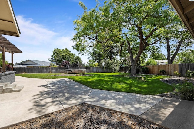 3321 W 24th Ave, Kennewick, WA 99337 - view of yard featuring a trampoline and a patio area