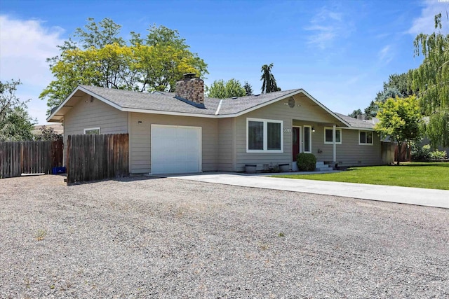 3321 W 24th Ave, Kennewick, WA 99337 - ranch-style home featuring driveway, an attached garage, a chimney, and roof with shingles