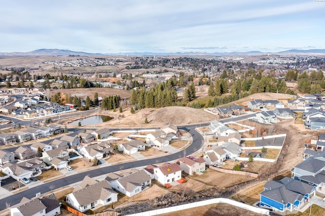 drone / aerial view featuring a residential view and a mountain view