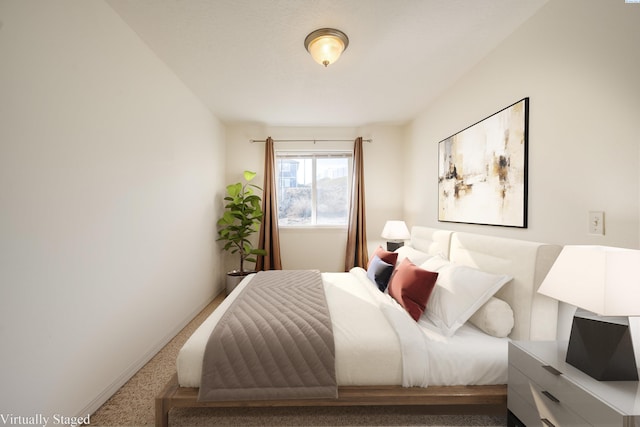 carpeted bedroom with baseboards