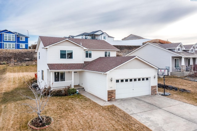 1065 SW Latour Peak St, Pullman, WA 99163 - traditional home featuring roof with shingles, covered porch, stone siding, and an attached garage