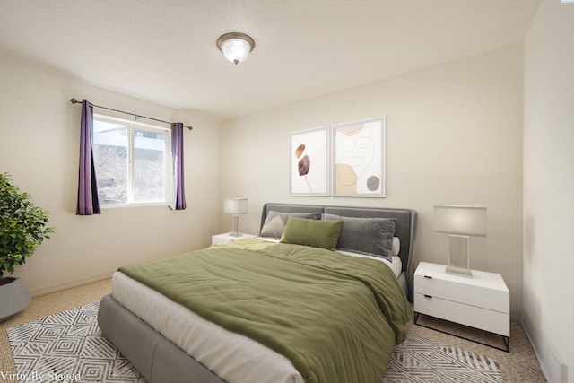 carpeted bedroom with baseboards