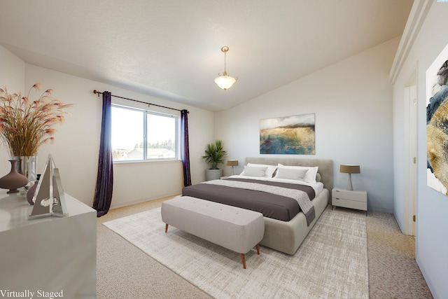 bedroom with light carpet and vaulted ceiling