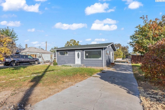 bungalow with a front yard