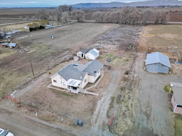 birds eye view of property with a rural view and a mountain view