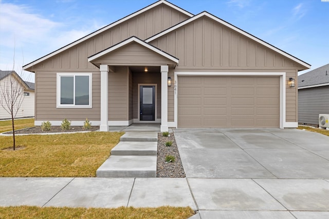 view of front of home with a garage and a front yard