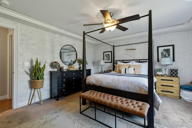 bedroom with brick wall, carpet, a ceiling fan, and crown molding